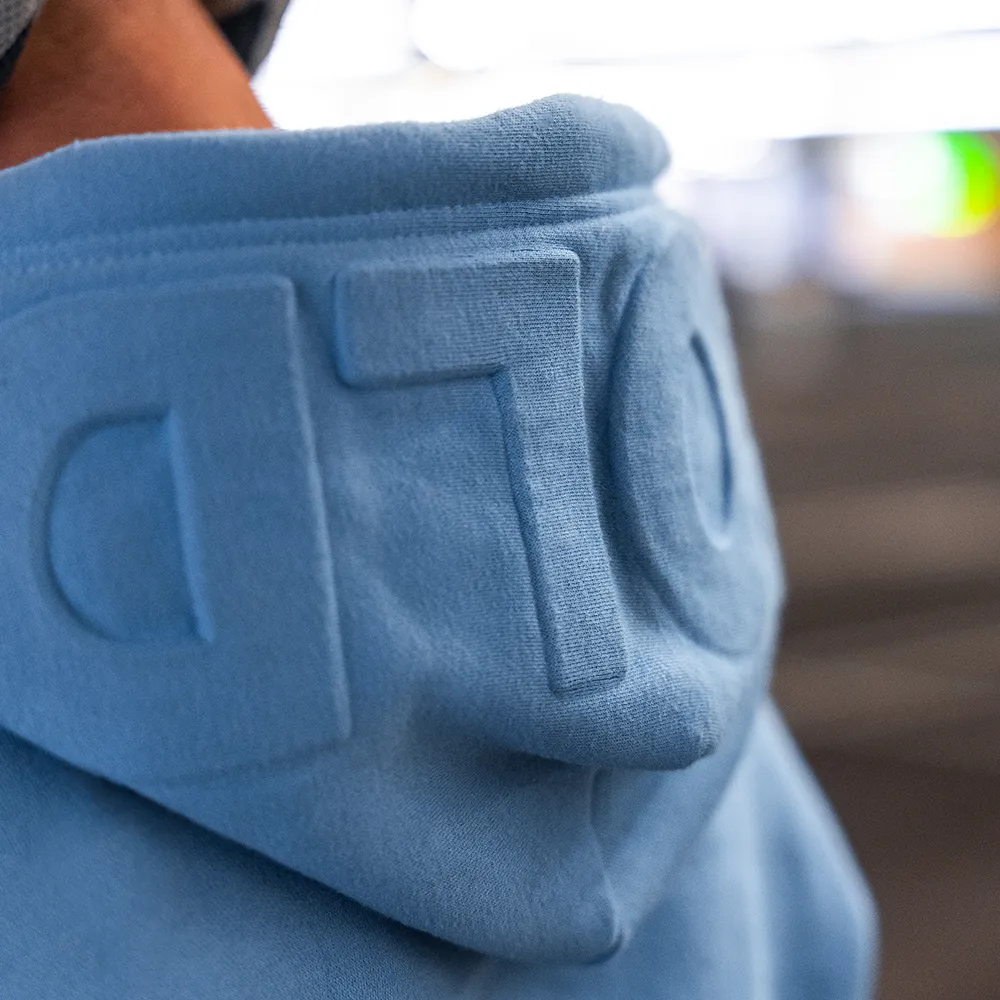 bold. Embossed Baby Blue Hoodie